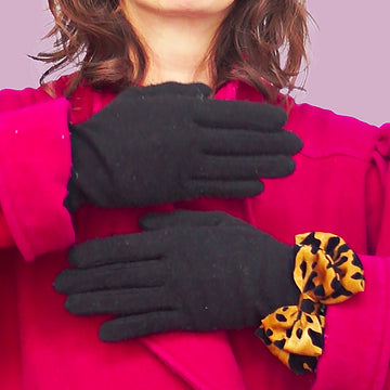 Jewel with leopard-print fabric bow worn over gloves
