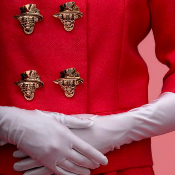 Jewel clip queen elizabeth queen of england Elizabeth II worn as a buttonhole on red suit and white gloves