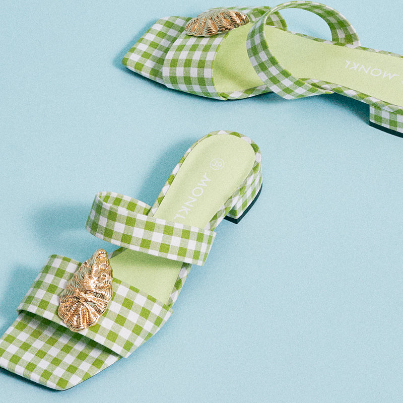 Gold oyster clip on green check sandals