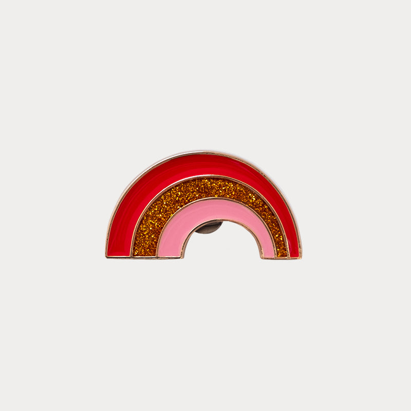 Jewel clip in the shape of a pink and glittery red rainbow