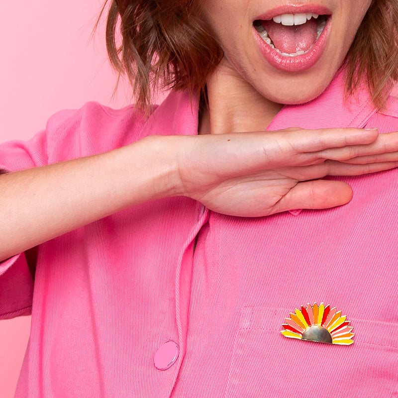 Sunset clip jewel worn on pink denim shirt pocket