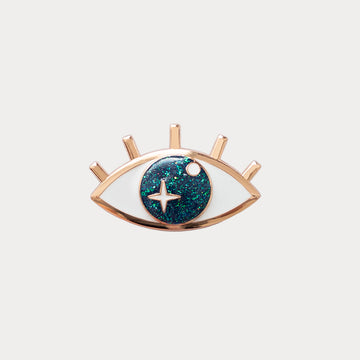 Clip on jewel in the shape of a blue glittering eye
